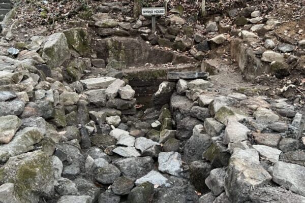 A wooden walkway in the middle of rocks.