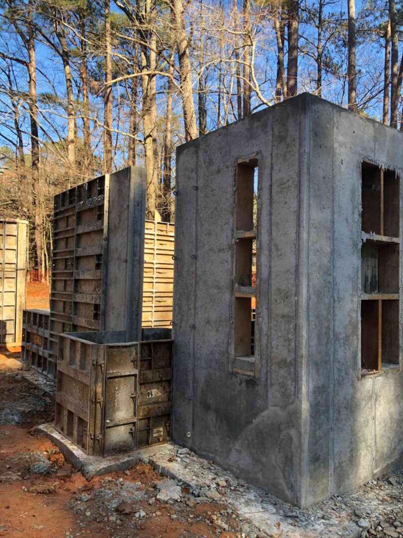 A concrete structure that is being used to build a house.