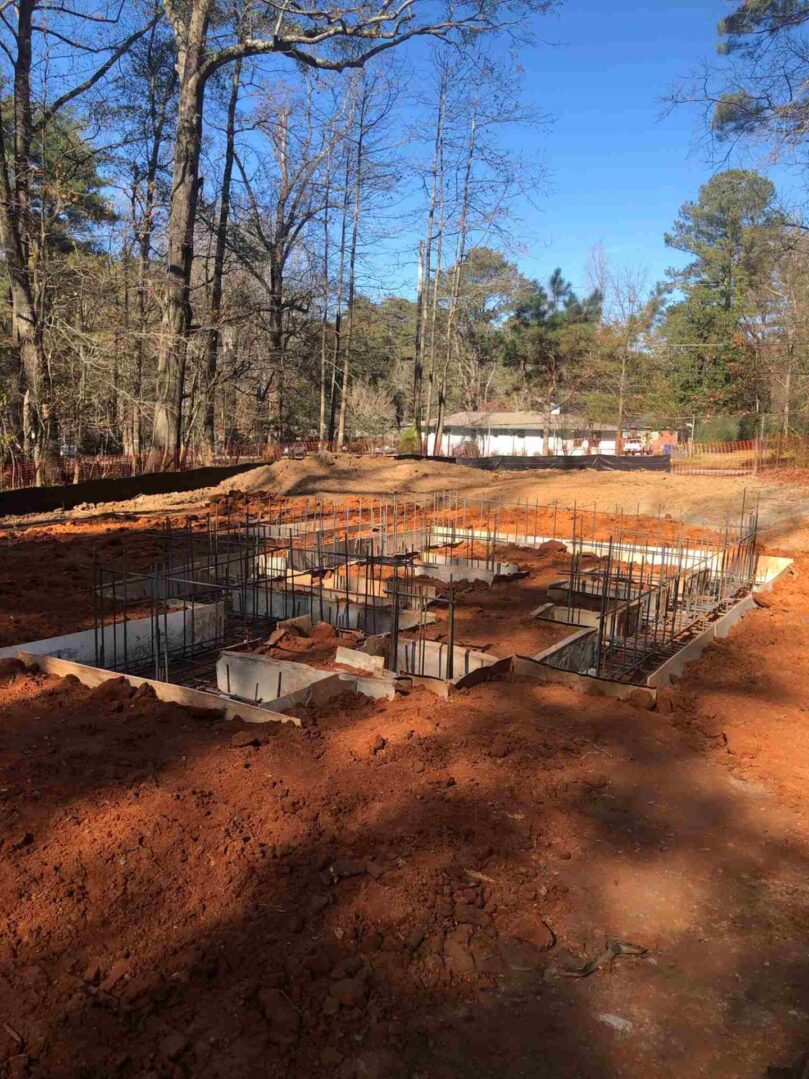 A building site with trees in the background