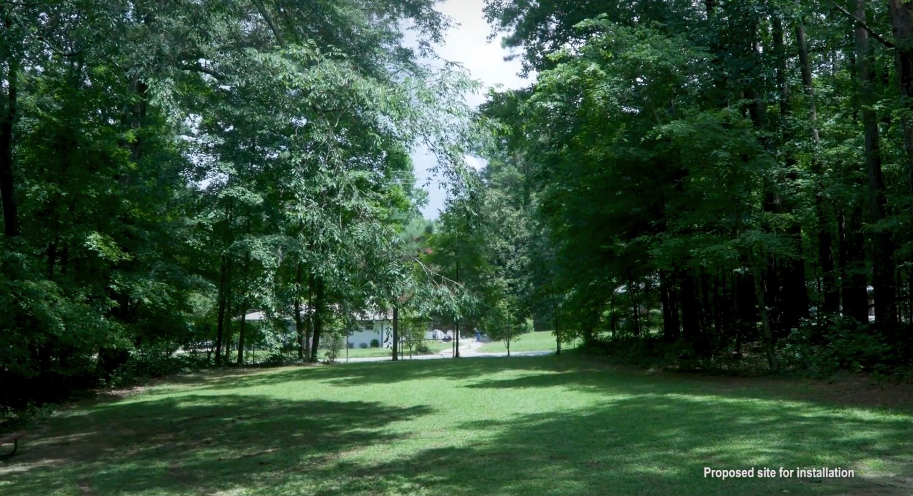 A park with lots of trees and grass.