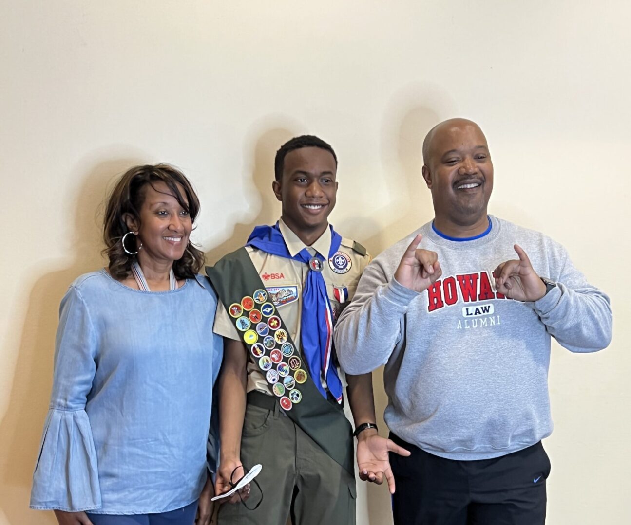 A man and two women standing next to each other.