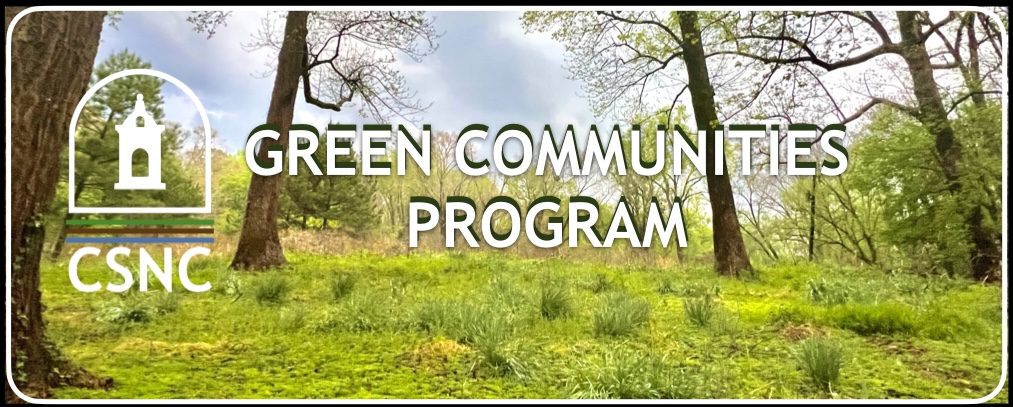 A green community program is in the middle of a field.