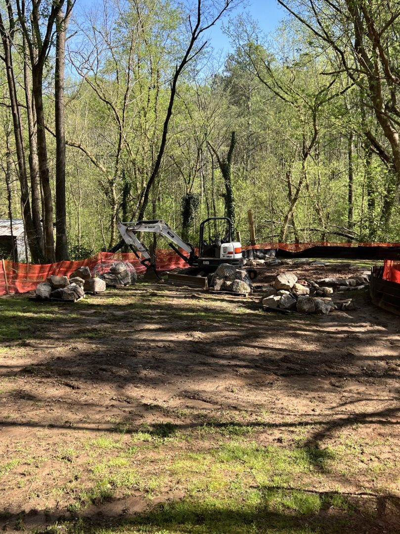 A pile of rubble in the middle of a forest.