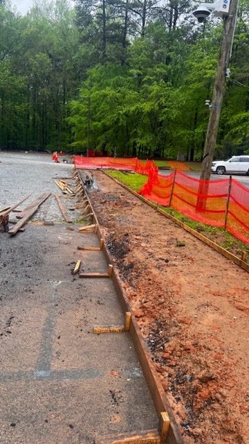 A road with dirt and wood on it