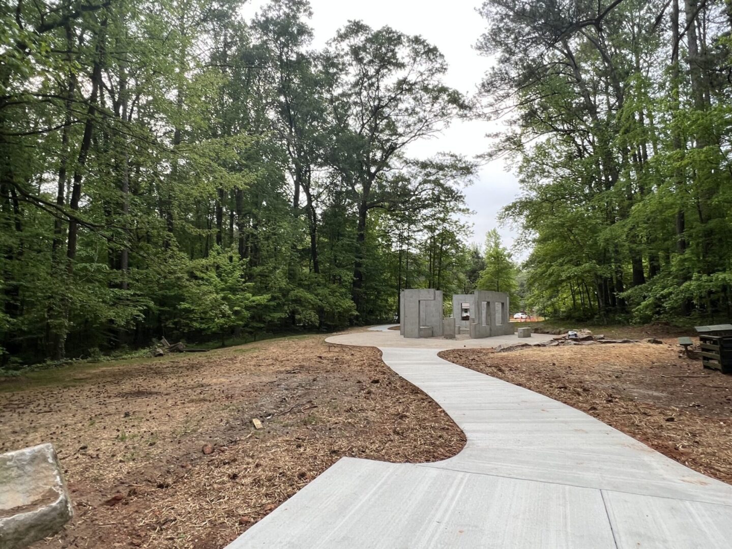 A path in the middle of a wooded area.