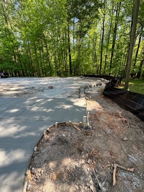 A concrete slab that has been laid in the ground.