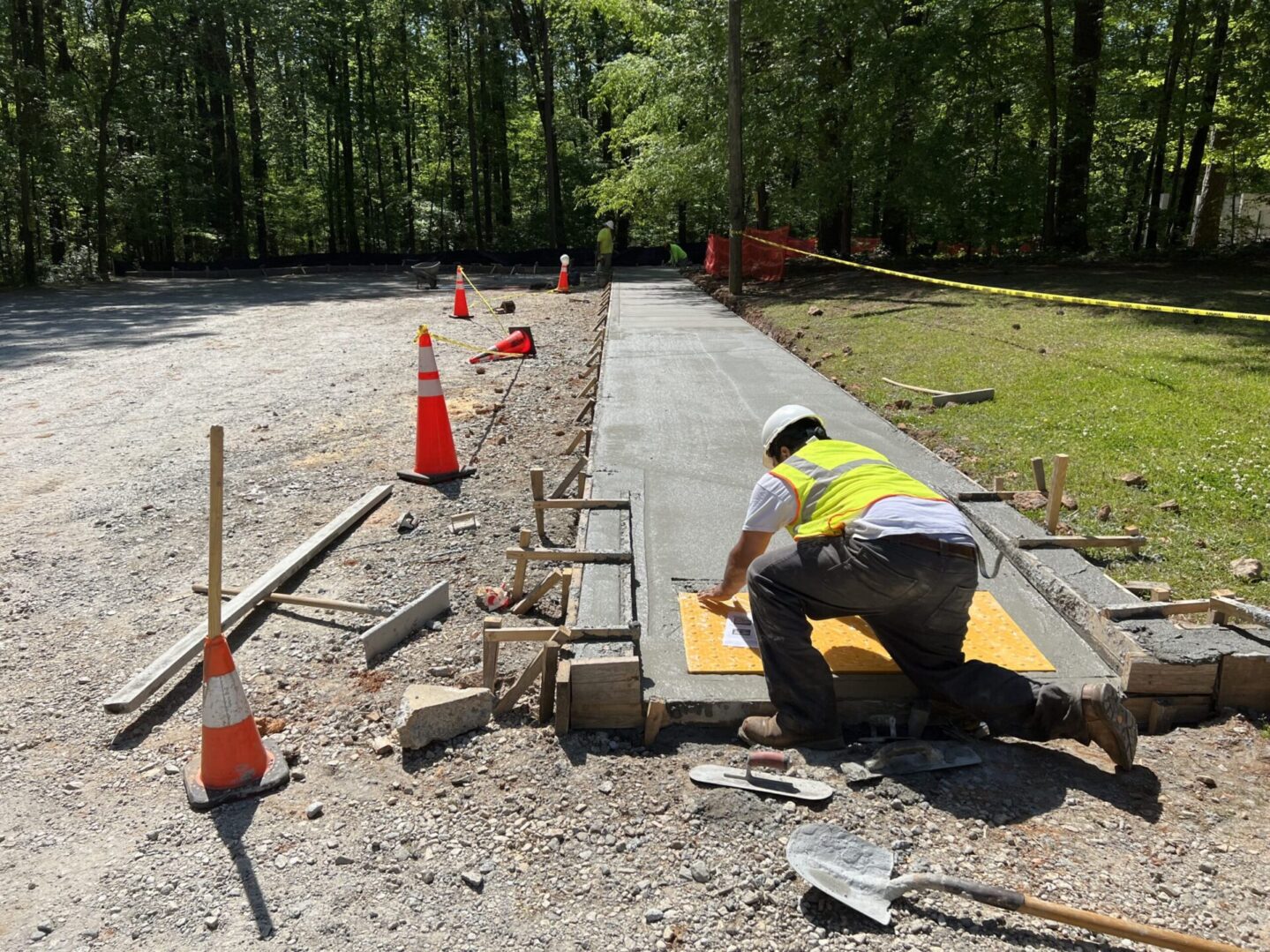 A man working on the side of a road.