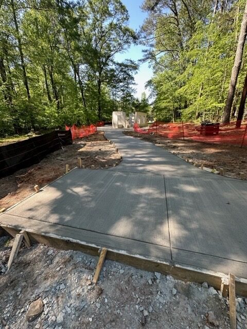 A concrete slab is being built on the side of a road.