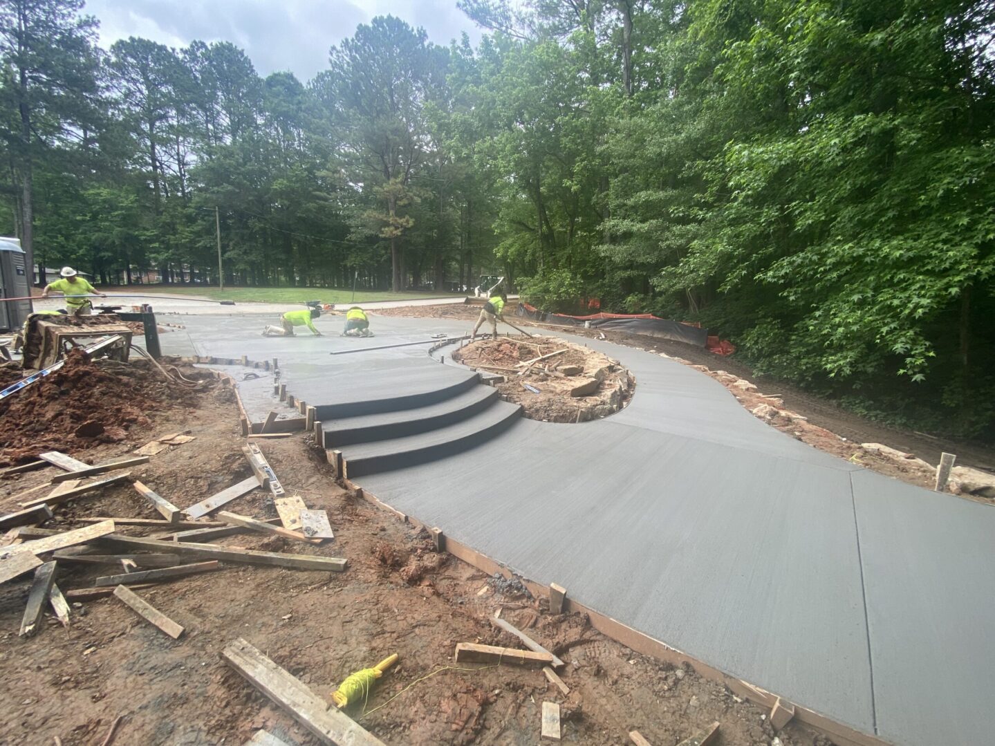 A concrete slab being poured for a park.