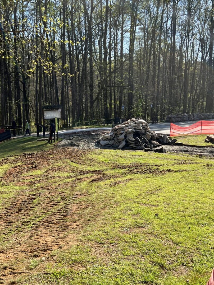 A pile of debris in the middle of a field.