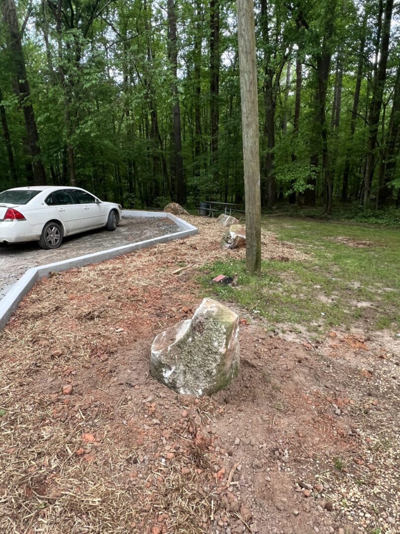 A white car parked on the side of a road.