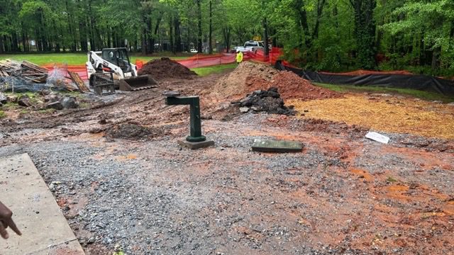 A pile of dirt on the side of a road.