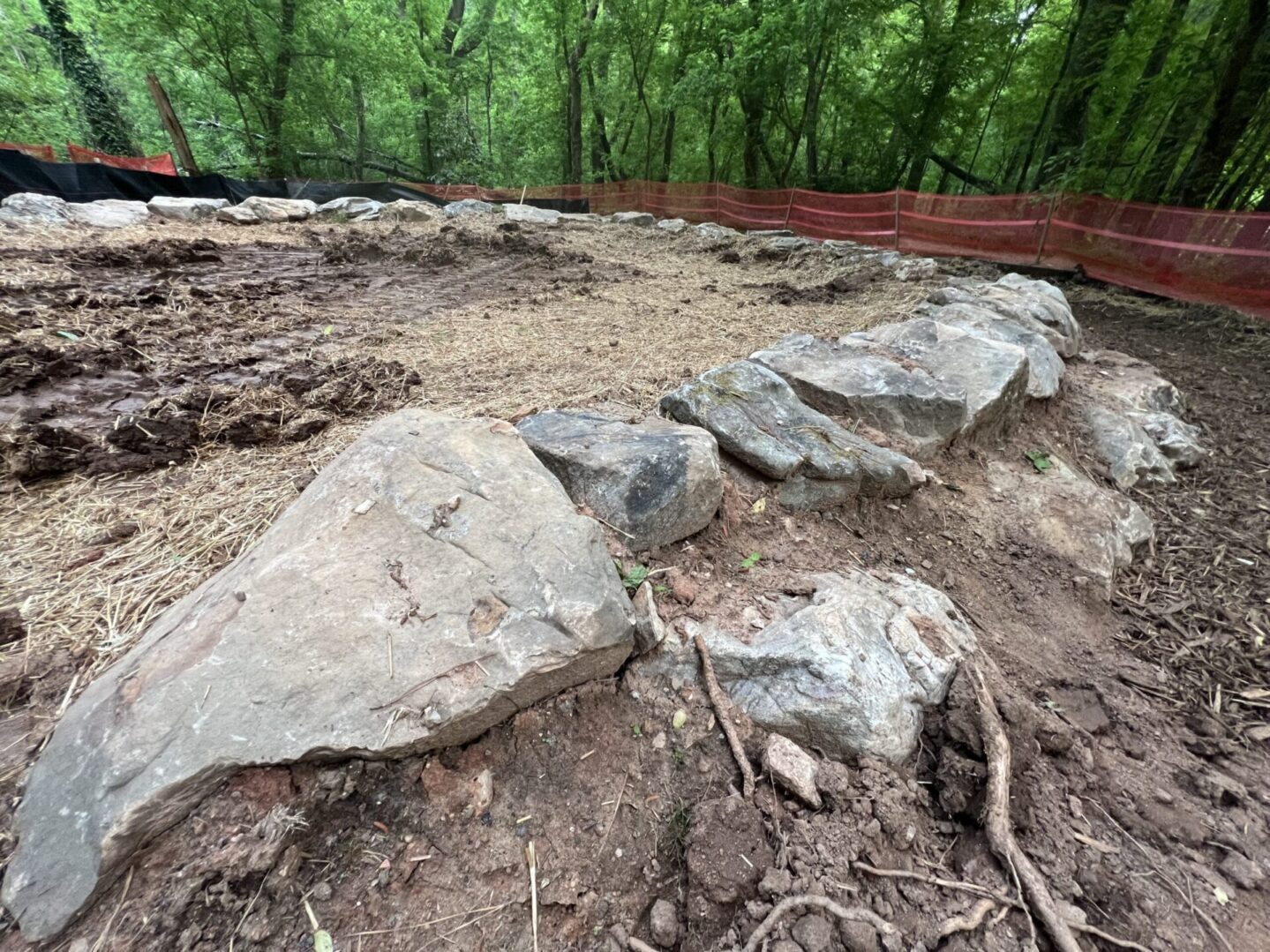 A field with rocks and dirt in the middle of it.