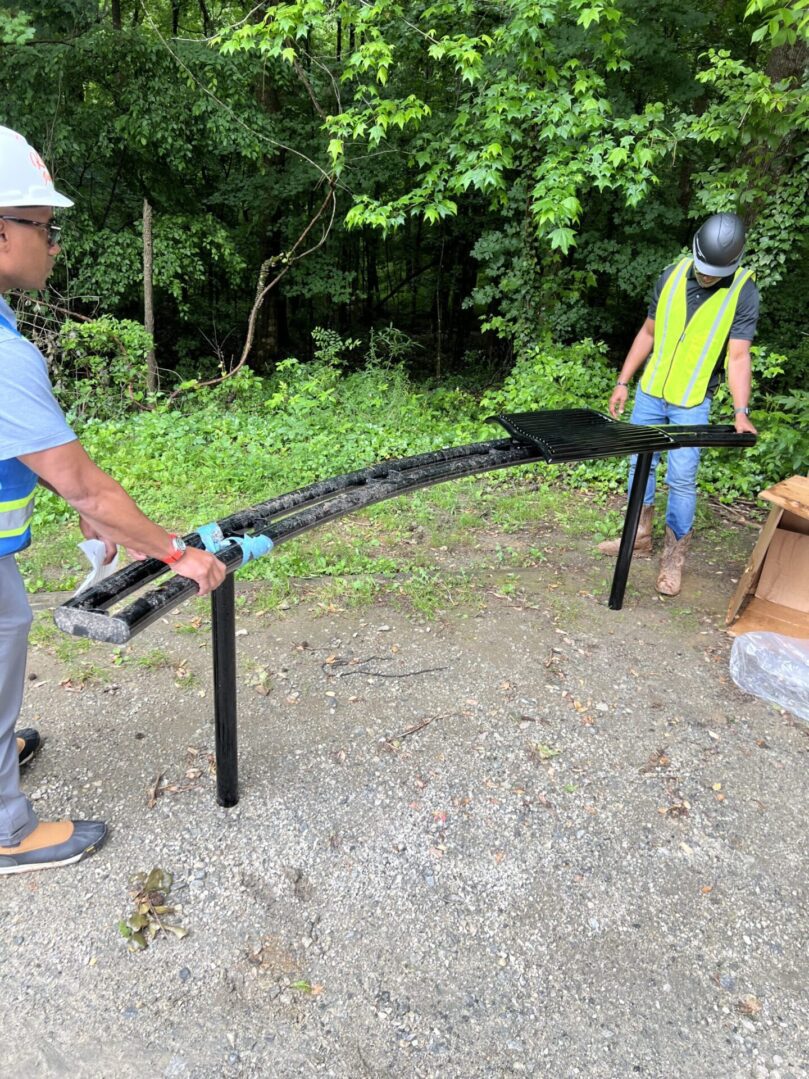 Two people working on a construction site.