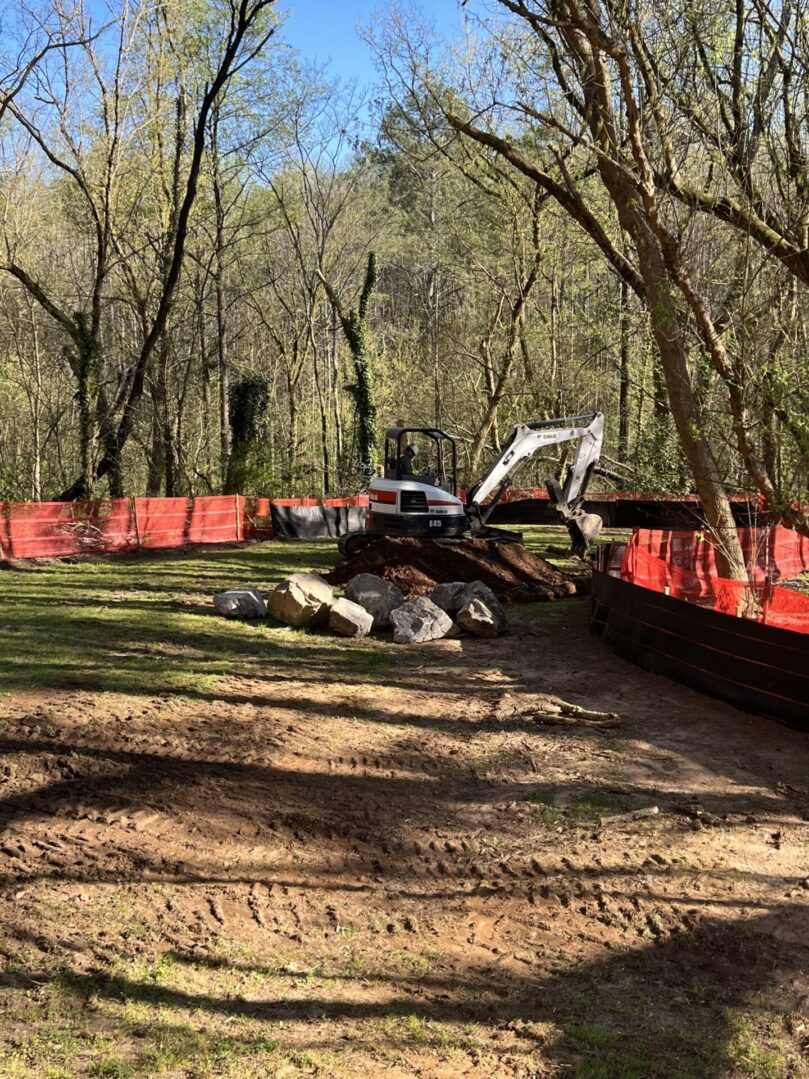 A construction site with a tractor and other equipment.