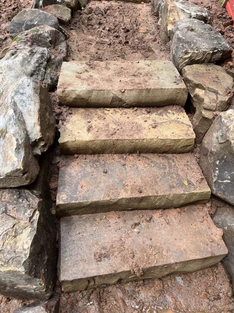 A stone staircase with steps leading up to it.