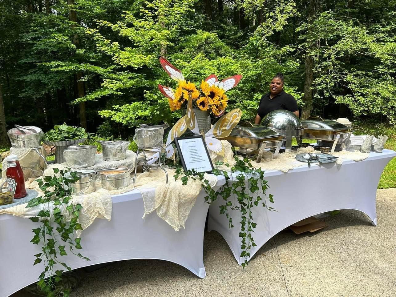 A table with flowers and plates on it