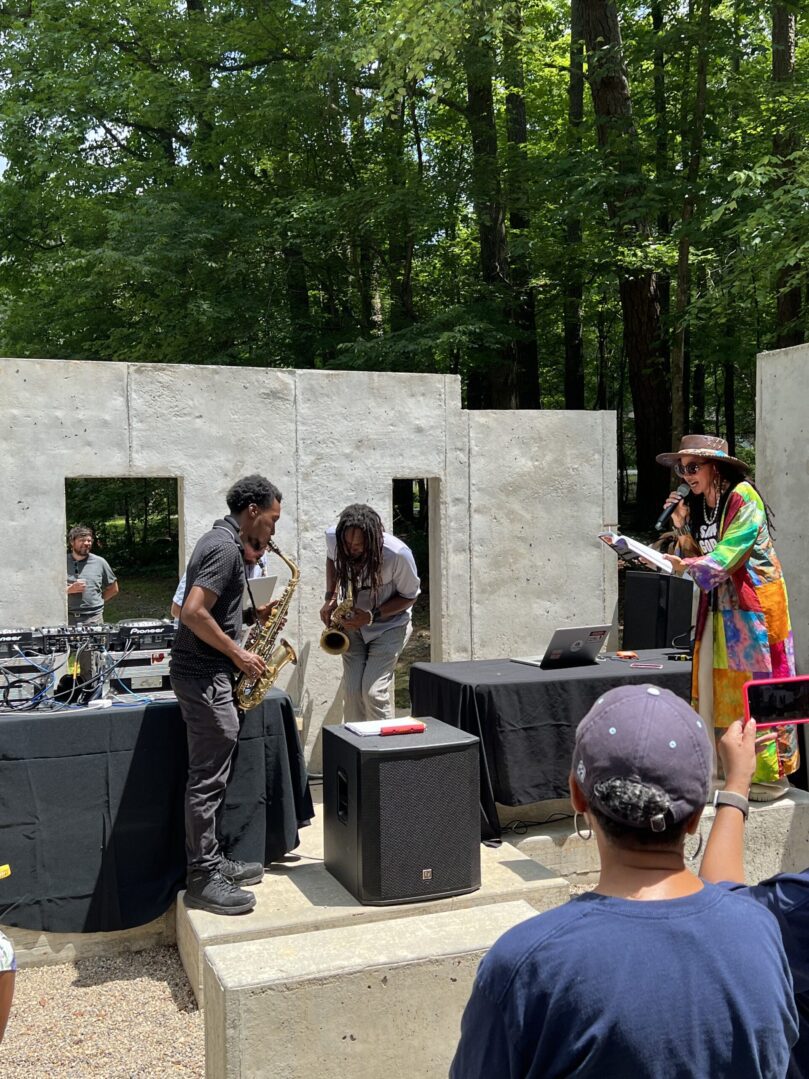 A group of people standing on stage in front of an audience.