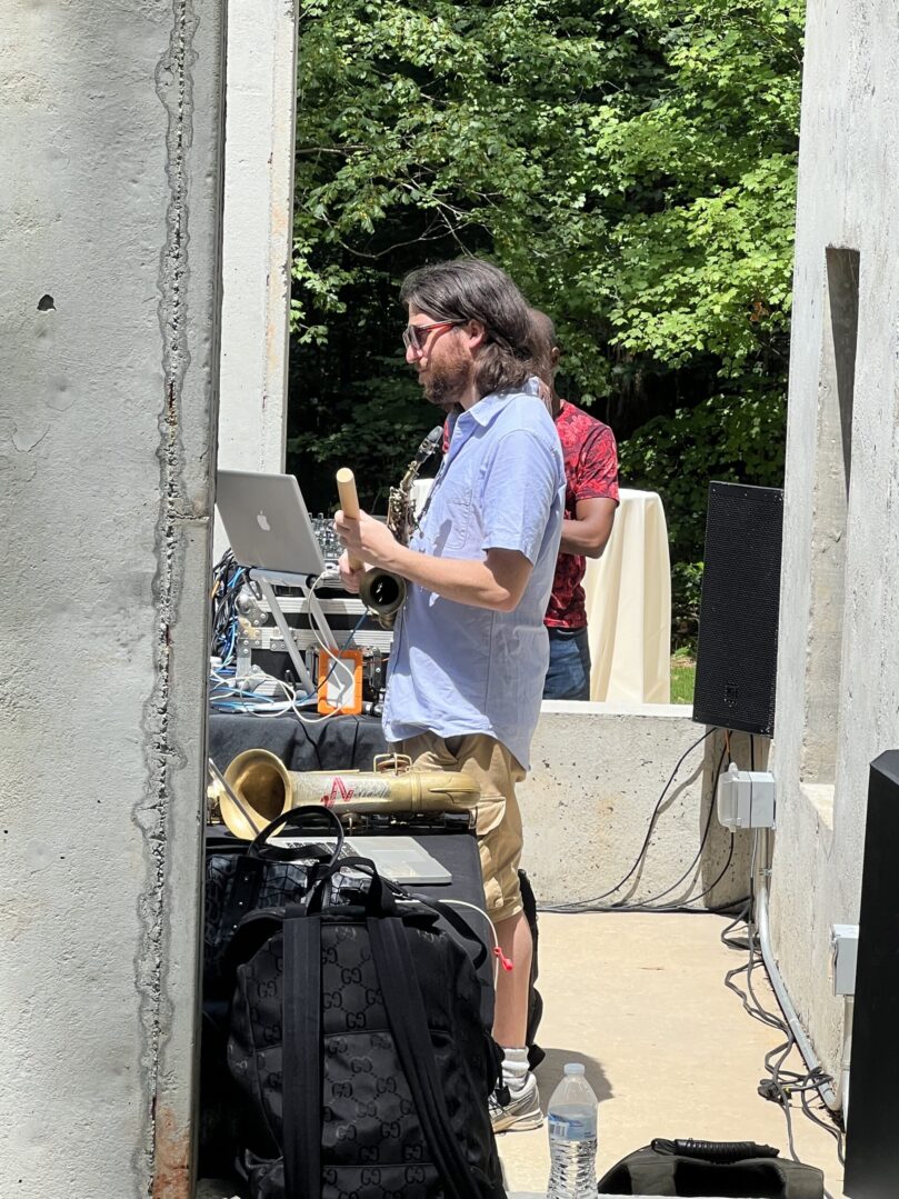 A man standing next to a bunch of instruments.