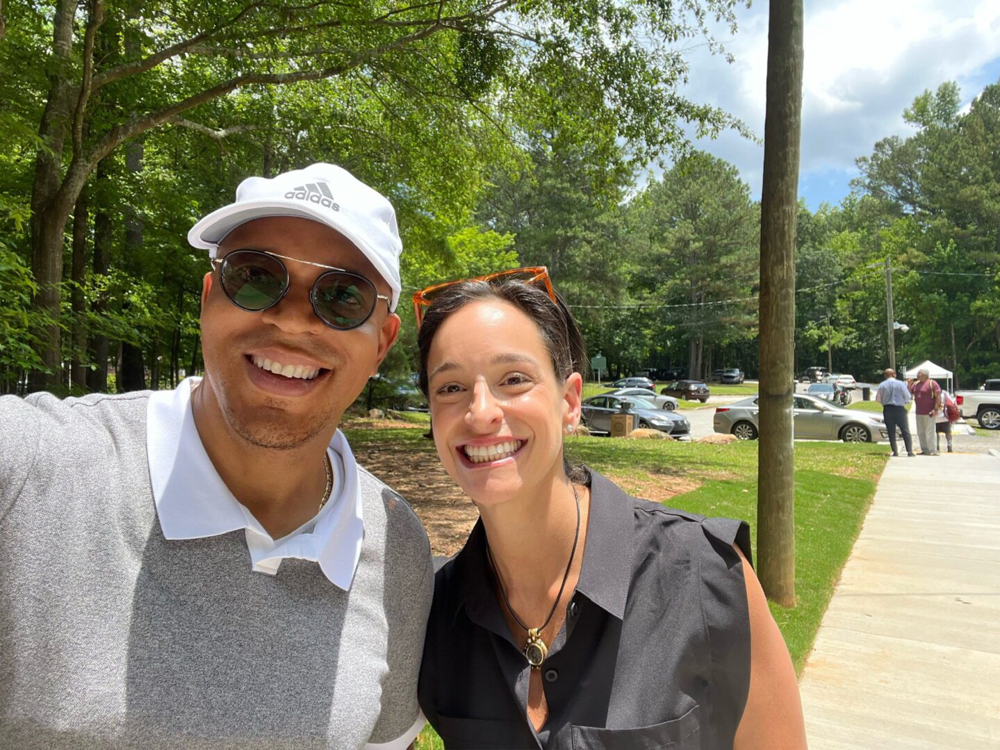 A man and woman smile for the camera.