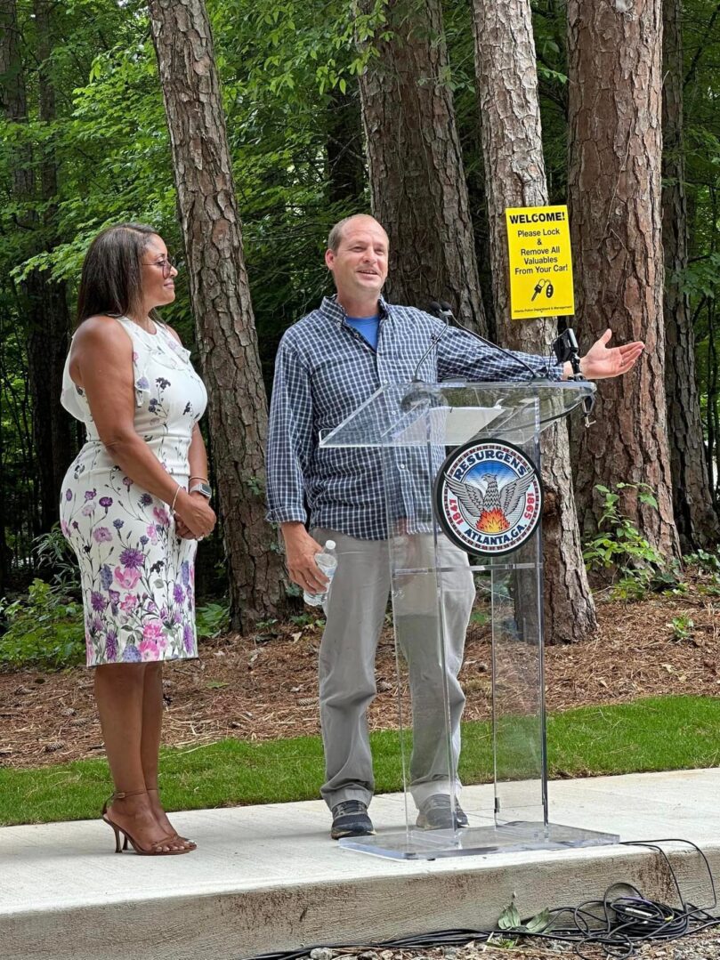 A man and woman standing next to each other.