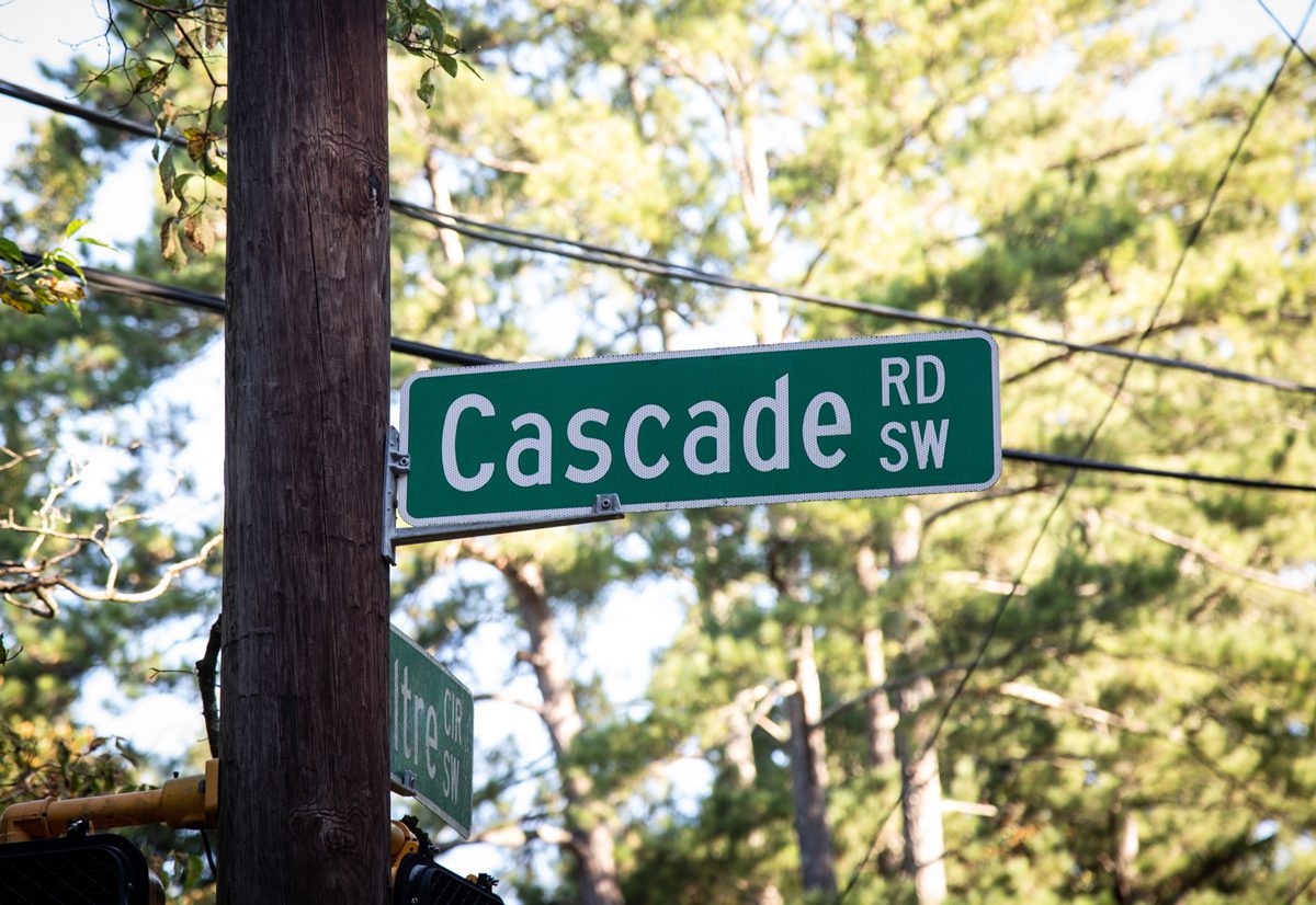 A street sign on the side of a road.