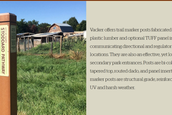 A picture of a barn and some grass.